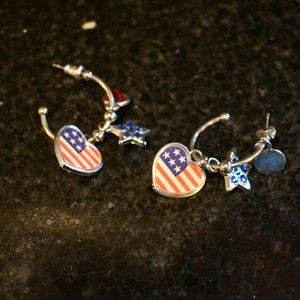 Set of charm pierced earrings.